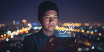 Thoughtful person transitioning from texting to a phone call on a smartphone